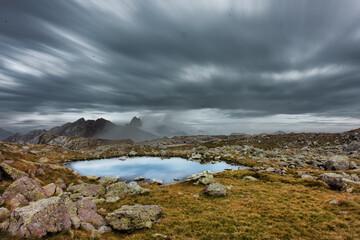 Landscape with small lake in the high mountains