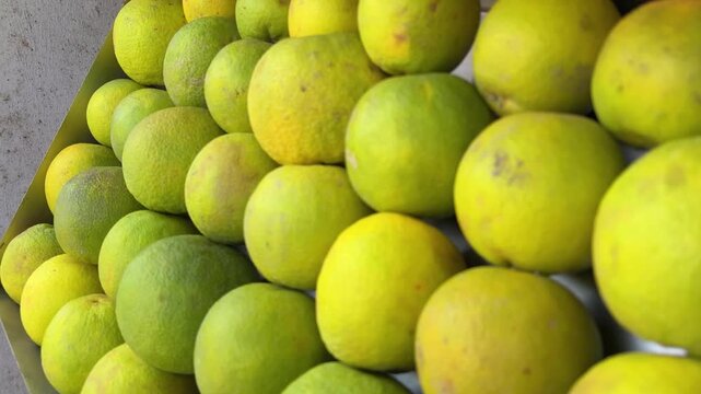 fruit stall with pineapples and mosambi ready for fresh juice preparation