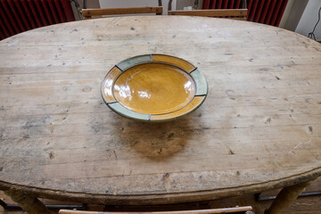 ovale interior table and empty salad bowl