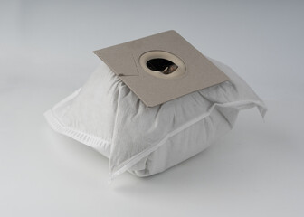 Used, dirty vacuum cleaner bag or sack full of dust and garbage