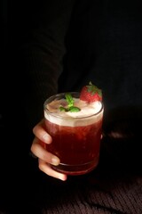 cold mocktail made from strawberries, tea, soda