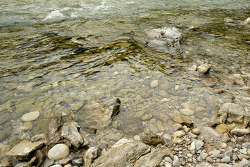 Obraz premium River Flow Over Rocky Bottom, Natural Water Background