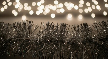 Sparkling silver tinsel garland with soft glowing lights bring festive cheer to your holiday projects, perfect for winter celebrations and seasonal joy