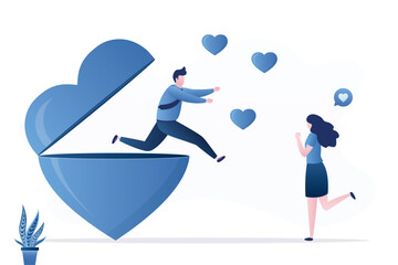 Love, relationships. Happy boyfriend jumps out of giant heart to meet his girlfriend. A date, declaration of love. Happy people, love couple