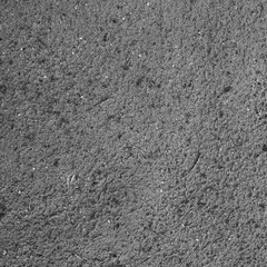 The texture of sand on the shore of a reservoir