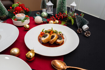 A beautifully arranged culinary dish on a table, with festive holiday decorations. The scene is perfect for a special meal celebration.