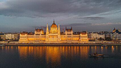 Fototapeta premium Budapest Parliament Building at night reflecting in the Danube River.