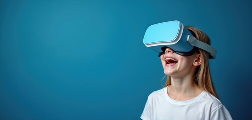 Young girl laughs with excitement while wearing blue virtual reality goggles. She enjoys immersive digital experience, exploring future tech on plain background. Futuristic fun.