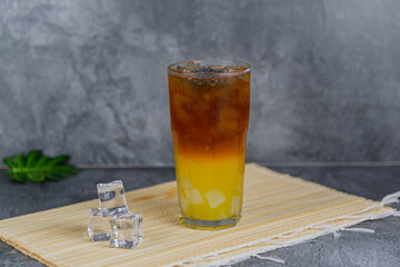 Orange tea is a refreshing blend of black tea and citrusy orange juice, sometimes with jelly cubes and basil seeds for extra texture. This vibrant drink offers a tangy, sweet, and cooling sensation.