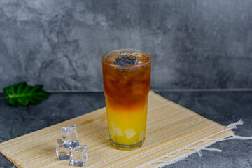 Orange tea is a refreshing blend of black tea and citrusy orange juice, sometimes with jelly cubes and basil seeds for extra texture. This vibrant drink offers a tangy, sweet, and cooling sensation.