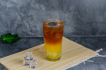Orange tea is a refreshing blend of black tea and citrusy orange juice, sometimes with jelly cubes and basil seeds for extra texture. This vibrant drink offers a tangy, sweet, and cooling sensation.