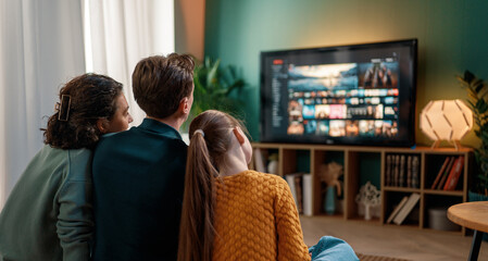 family watching  TV at home