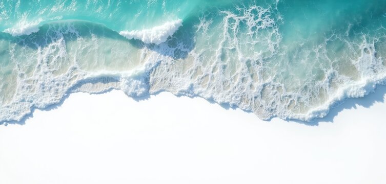 Aerial photo of ocean waves crashing onto a white beach. Turquoise water creates a beautiful pattern. Natural beach texture with foam and water edge. Peaceful summer seaside view.