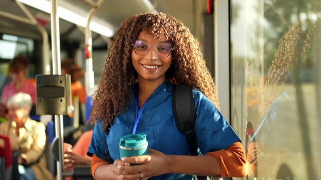 African american female nurse commuting on public bus