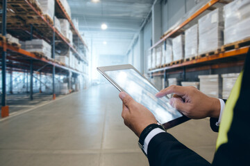Efficient warehouse management with modern tablet technology for streamlined logistics and inventory tracking, ensuring smooth supply chain operations and optimized workflows