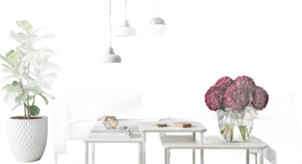 A bright and airy contemporary living room scene featuring minimalist white tables, a lush houseplant, and a vibrant floral arrangement under modern pendant lights