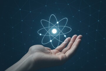 Hand holding a holographic atom model, symbolizing scientific research, innovation, and the intersection of technology and human potential in physics and education.