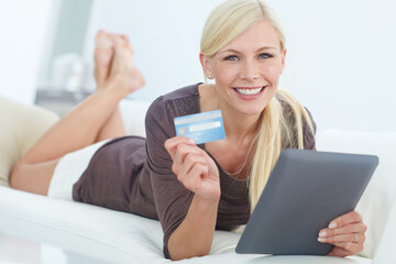 Portrait, tablet and happy woman with credit card in home for online shopping, budget or payment. Debit, smile and person in living room with money for digital deposit, internet banking or discount