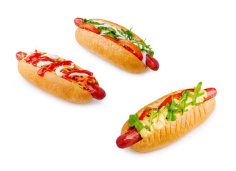 Three delicious hot dogs with various toppings on a white background