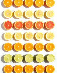 Citrus slices on white background. Flat lay, top view.