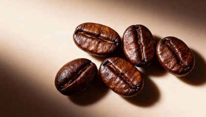Coffee beans on a beige background. Close up.