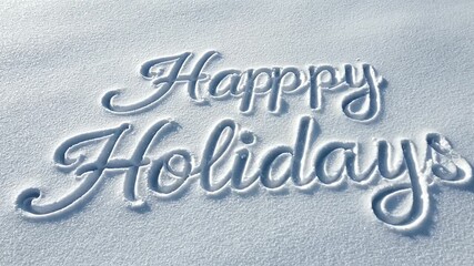 Overhead view of Happy Holidays message written in fresh white snow during the winter holiday season perfect for festive greetings and seasonal wishes - Powered by Adobe