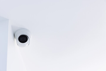 IP CCTV camera on white background with home security system concept. CCTV camera on the ceiling