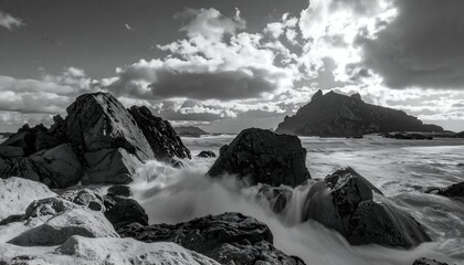 Dramatic Black and White Seascape with Crashing Waves and Rocky Outcrops.
