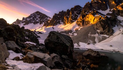 Majestic Mountain Peaks Bathed in Golden Light at Sunset.
