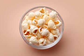 Deliciously fluffy popcorn in a clear bowl ready for a cozy movie night or snack time treat. National Popcorn Day