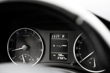 Car dashboard - close-up of the tachometer and speedometer