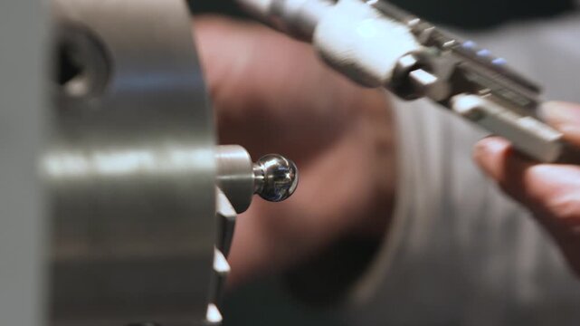 Technician Inspecting Precision Machined Metal Part in Manufacturing