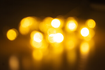 A dreamy, out-of-focus shot of warm yellow lights creating a beautiful bokeh effect.