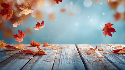 Falling autumn leaves on rustic wooden table background. Seasonal concept for Thanksgiving day, Fall festival or holiday banner design.