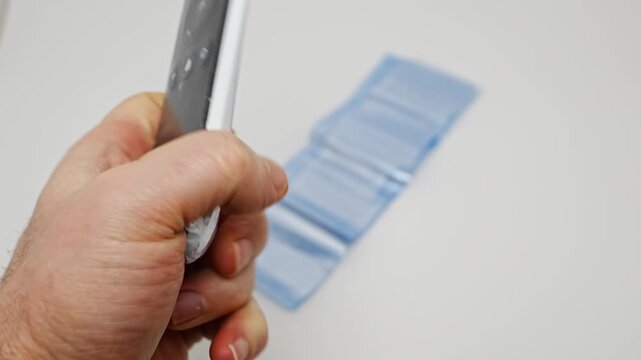 Wrapping a remote control in protective film