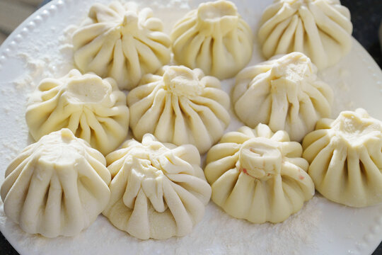 Making khinkali with a special tool in Georgian cuisine