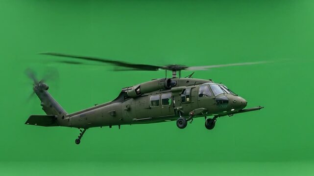 A Blackhawk Helicopter Flies Against a Green Screen Background for Visual Effects Compositing and