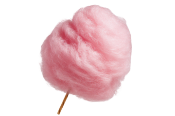Fluffy, pink confection on a stick, isolated against a black background