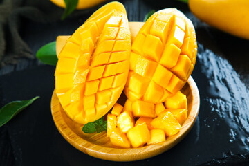 Fresh Sliced Mango Fruit in Wooden Bowl - Tropical Exotic Fruit Display with Golden Yellow Flesh