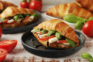 Croissants with mozarella cheese and tomatoes in caprese style