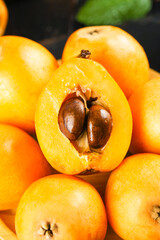 Fresh Yunnan Mountain Loquats Cut Open Showing Sweet Orange Flesh and Seeds