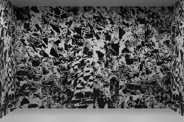 An empty bathroom with black and white marble tiles and a white floor. The room features a ceramic backdrop. Bathroom interior with marble tiles.