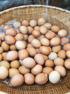 Fresh eggs in the woven basket to stream at the hot spring
