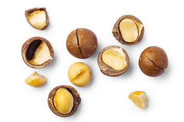 Macadamia nuts with cracked nut and shell  isolated on white background, top view