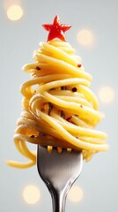 Close-up of spaghetti resembling a Christmas tree on a fork, adorned with a red star, evoking holiday warmth.