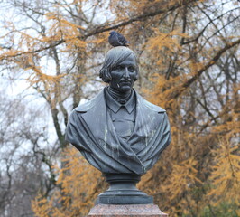 A dove sits on a bronze bust of Nikolai Gogol, Alexander Garden, Saint Petersburg, Russia, November 17, 2025