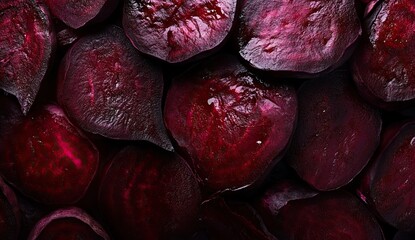 A close-up of freshly sliced beets, showcasing their deep red and purple hues with intricate, natural patterns