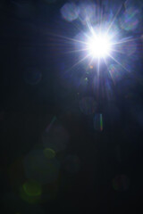 Abstract imitation sun starlight distant galaxy on a black background.