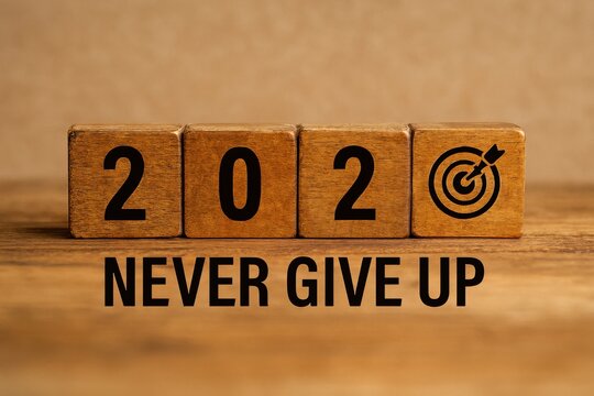 2020 never give up goal setting, wooden blocks, target icon