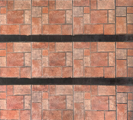 Obraz premium Close up of natural red tiles with random rectangular and square pattern, with black stripes. Geometric random size rectangular red tiles made of clay and stone. Seamless background texture.